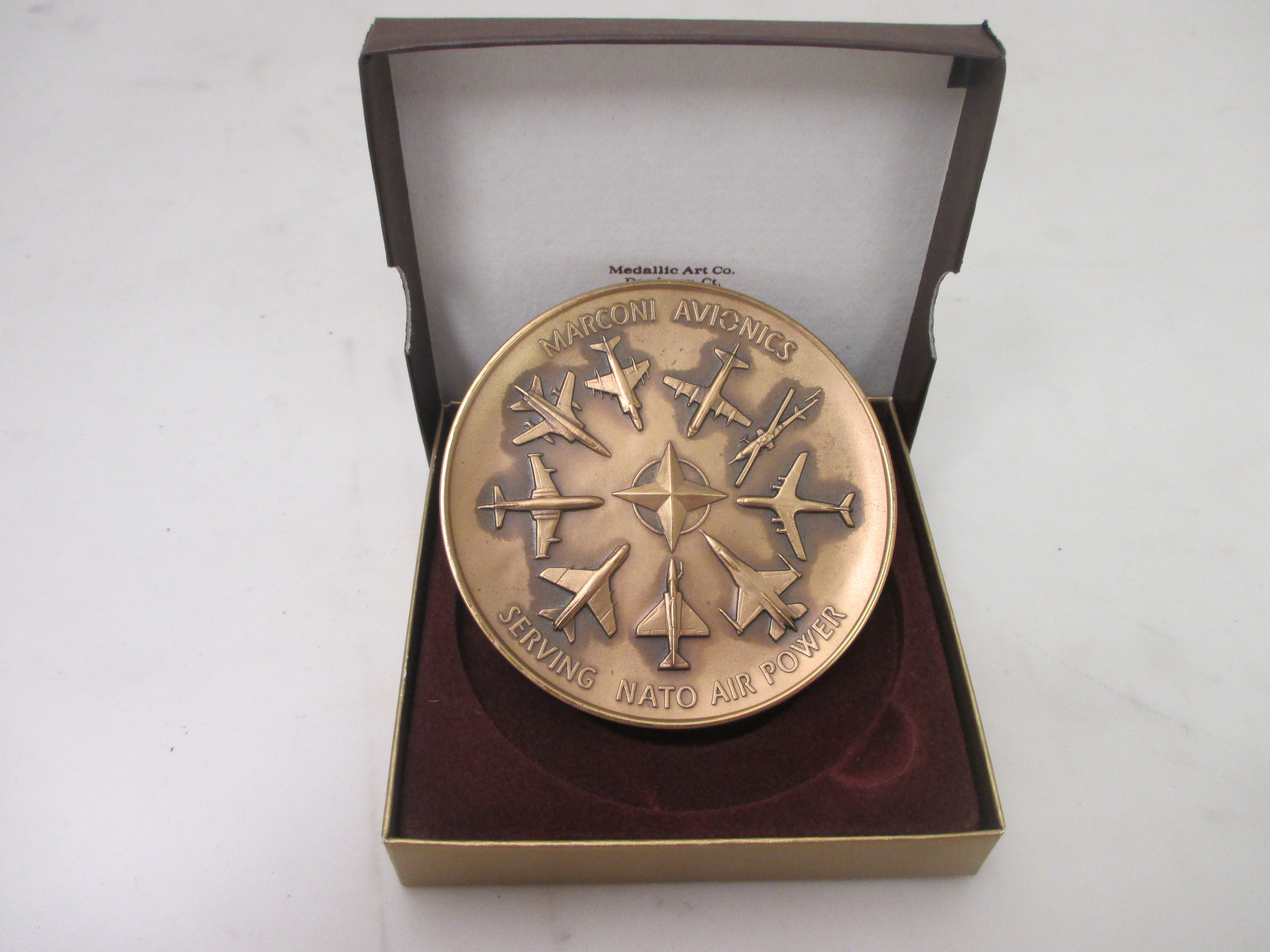 Medallion commemorating the opening of new facility in Atlanta.