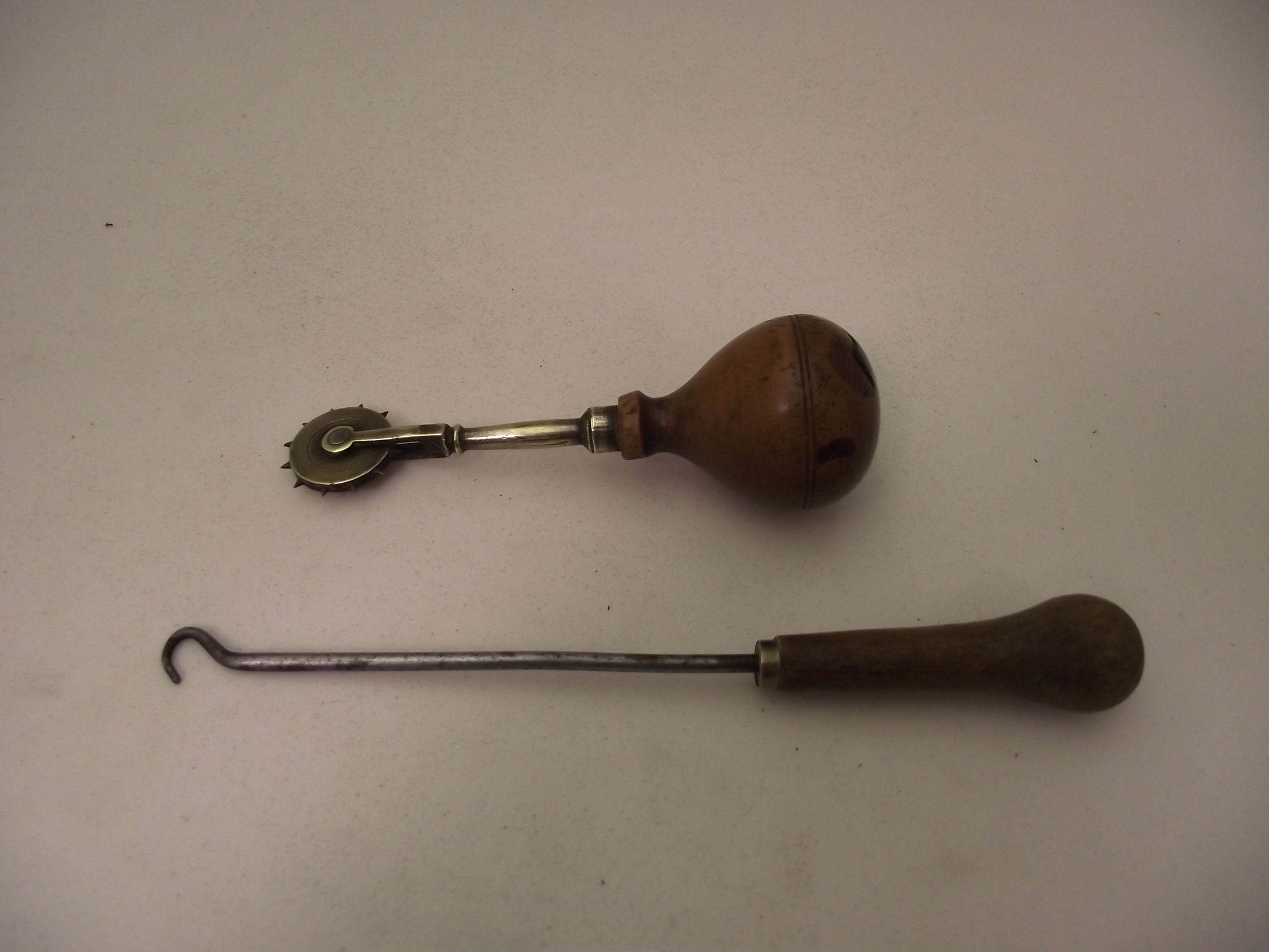  Button Hook and Leather stitch marking tool.